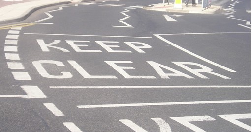 A road marking reading Keep Clear