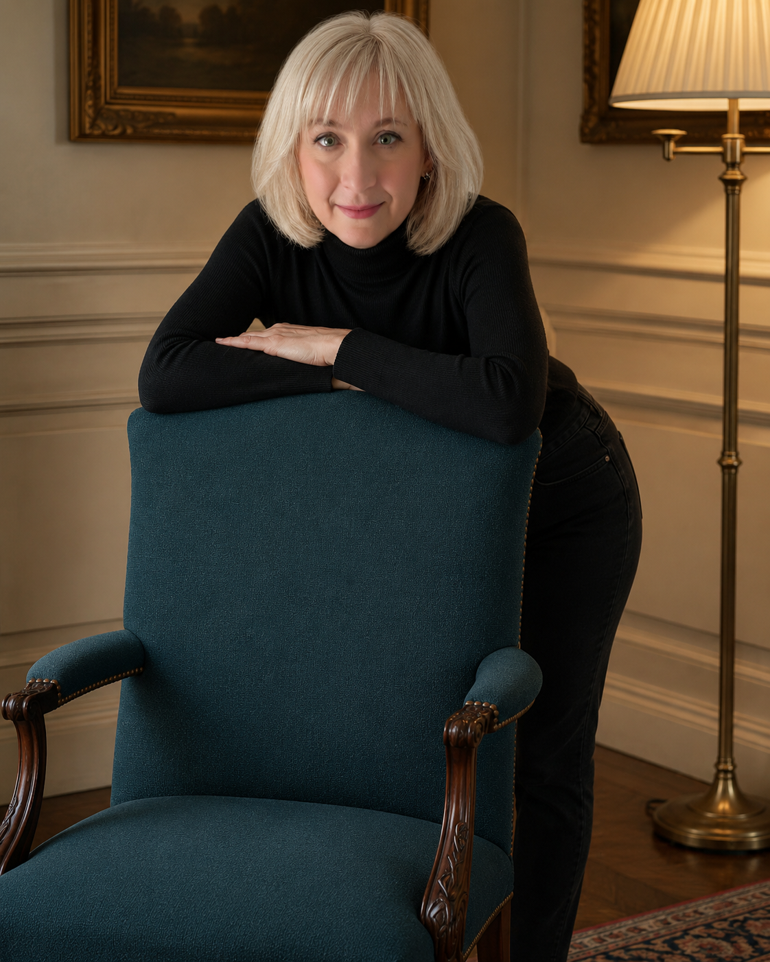 Natalie Shelpuk seated in a teal chair, looking into the camera